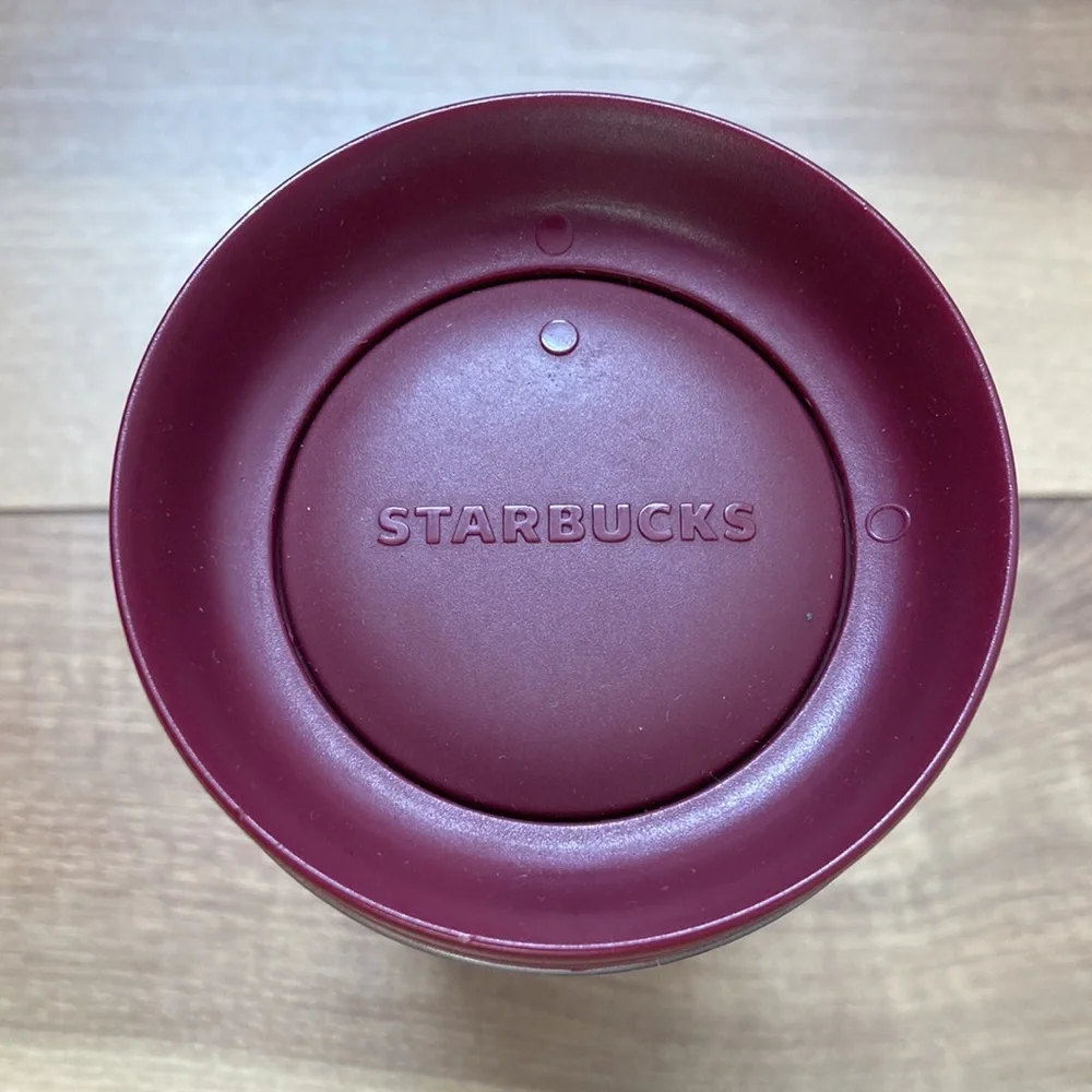 Starbucks khaki and earth tone tumbler thermos.